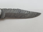 Taschenmesser mit Damastklinge